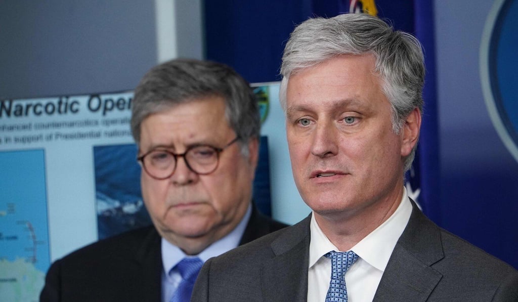 National Security Advisor Robert O'Brien (right) speaks while US Attorney General William Barr listens during the daily briefing on the novel coronavirus in the Brady Briefing Room at the White House. Photo: AFP