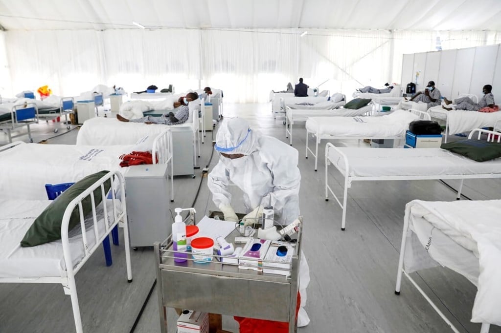 A nurse works in a field hospital built on a soccer stadium in Machakos, Kenya, last week as the number of confirmed cases continues to rise in the country. Photo: Reuters