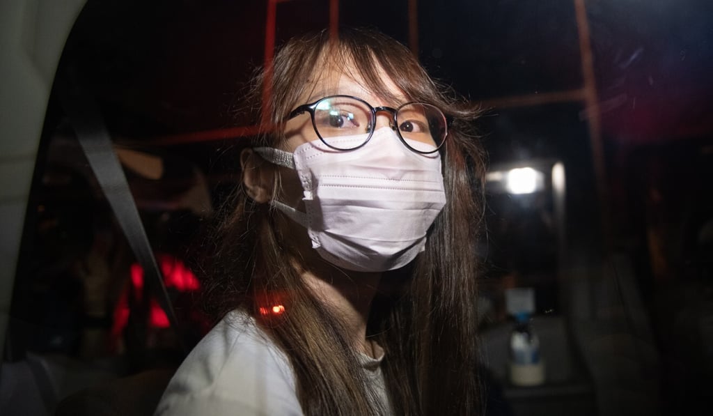 Pro-democracy activist Agnes Chow sits in a police van after being arrested at her home on Monday. Photo: EPA-EFE