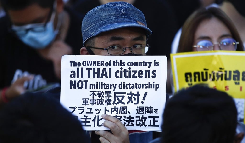 Pro-democracy demonstrators hold signs during an anti-government rally in Bangkok on August 10. Photo: EPA-EFE Pro-democracy demonstrators hold signs during an anti-government rally in Bangkok on August 10. Photo: EPA-EFE