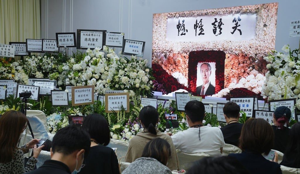 Members of the press watch a live stream of the funeral service of gambling magnate Stanley Ho at the Hong Kong Funeral Home in North Point in July. Photo: Sam Tsang