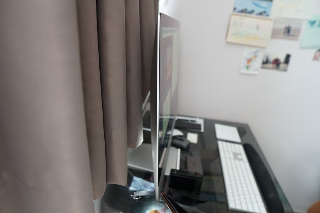 The processor, memory and other components are placed inside the skinny monitor. There’s no tower or body, unlike most PCs. Photo: Ben Sin