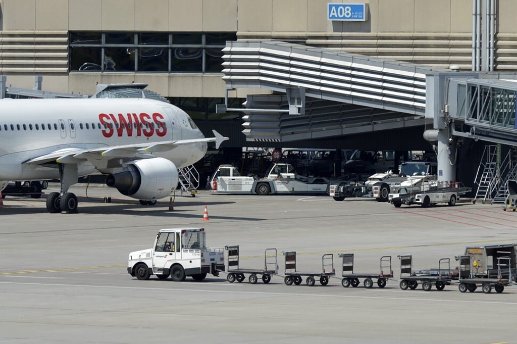 A Swissport baggage cart is seen at Zurich airport. Photo: EPA