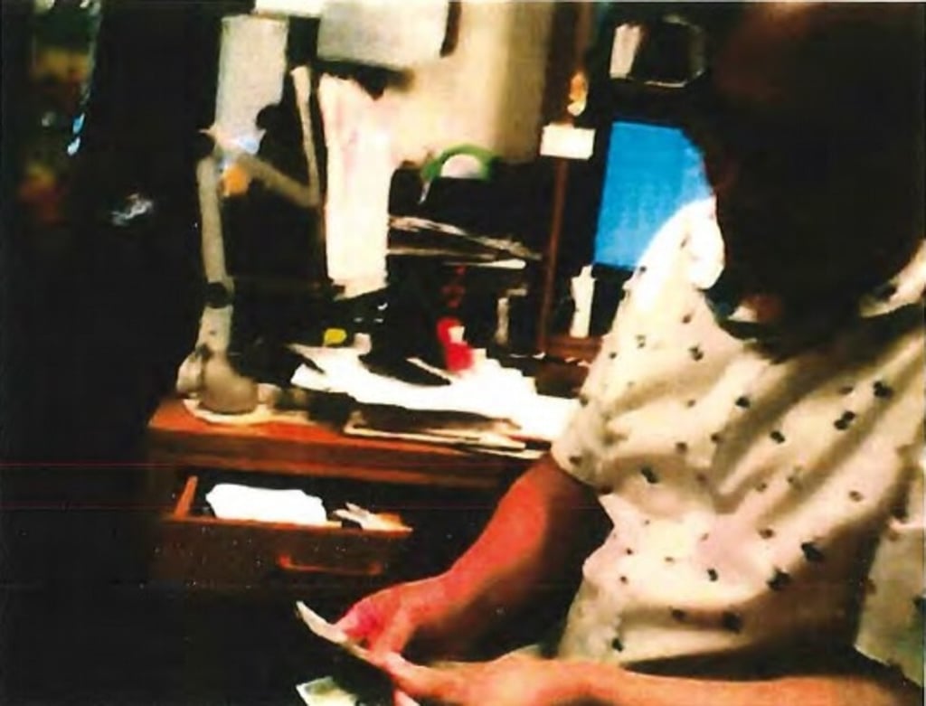 A screen grab from a video made in August 2019 shows Alexander Yuk Ching Ma allegedly counting money given to him by an undercover FBI agent. Photo: US Justice Department A screen grab from a video made in August 2019 shows Alexander Yuk Ching Ma allegedly counting money given to him by an undercover FBI agent. Photo: US Justice Department