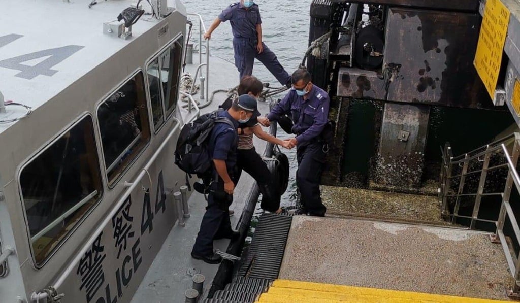 A marine police launch ferry mother and son from the islet to a pier in Sai Kung. Photo: Handout