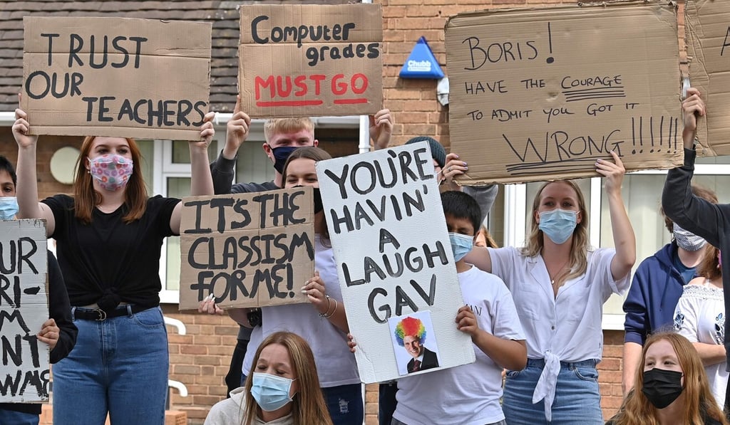Students from Codsall Community High School protest against the downgrading of A-level results. Photo: AFP Students from Codsall Community High School protest against the downgrading of A-level results. Photo: AFP