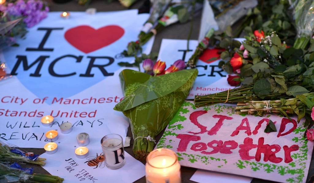 Messages and floral tributes in Manchester after the attack. Photo: AFP