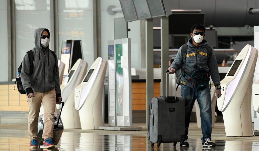 Passengers arrive at the departure hall of Changi International Airport in Singapore. Photo: AFP Passengers arrive at the departure hall of Changi International Airport in Singapore. Photo: AFP