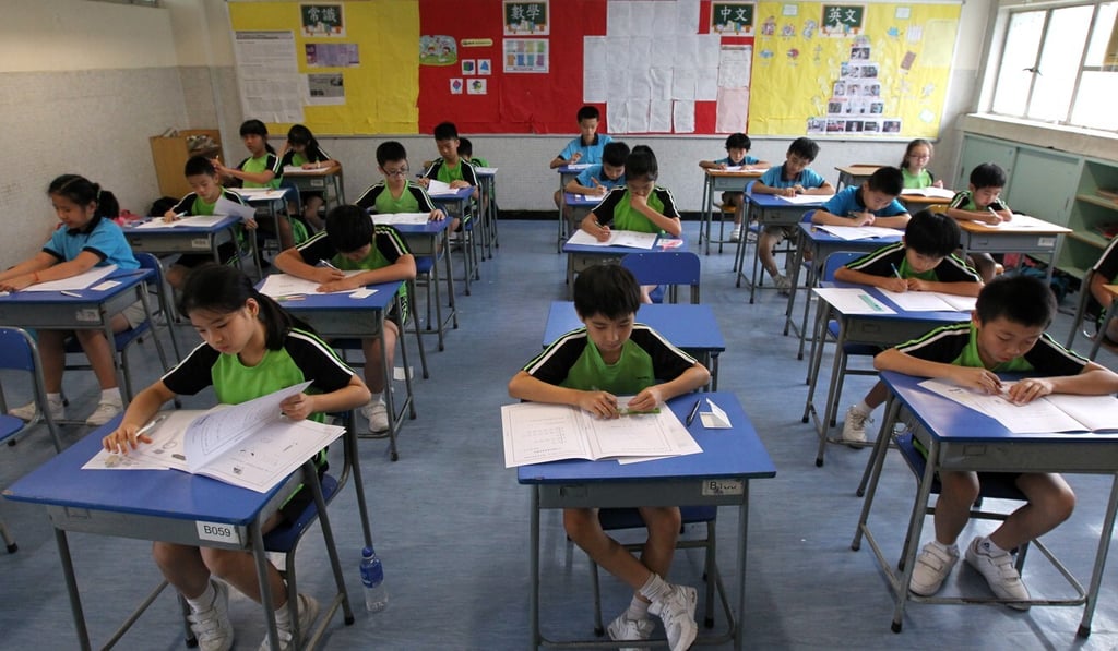 Students take a test to determine their secondary school placement. Photo: Roy Issa