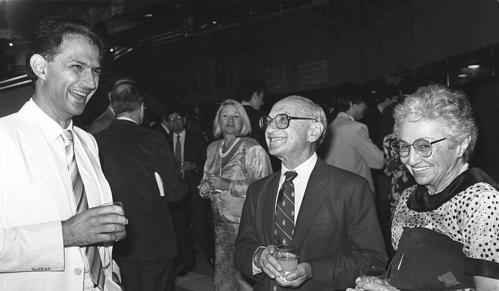 Nobel Prize winning economist Professor Milton Friedman (second right) and his wife Rose (right) chat with a guest at a welcome party during his visit to Hong Kong in 1988. Photo: M. Chan
