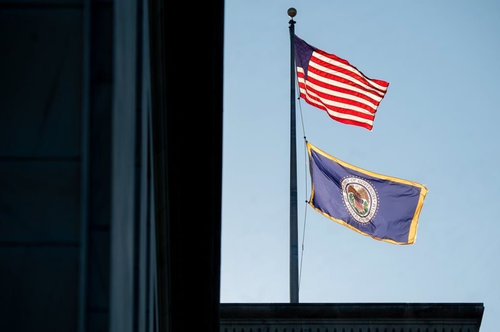 Flags for the US and the US Federal Reserve fly outside the Federal Reserve building in Washington, DC, on August 18. American citizens helped finance World War II by buying US bonds. Fed employees also got in on the act, holding competitions to see whose office could buy more bonds. Photo: Bloomberg