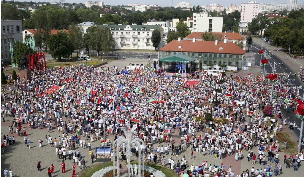 People listen to Belarusian President Alexander Lukashenko during a rally in his support in Grodno on August 22. Photo: AP