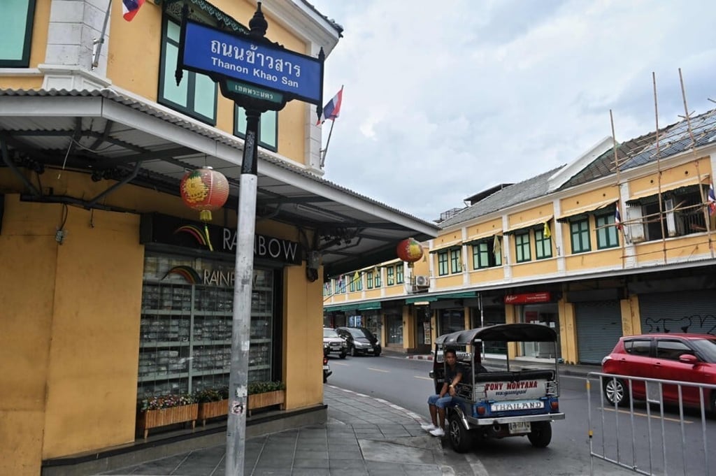 A tuk-tuk driver waits for customers at an empty Khao San Road which is normally thronging with foreign tourists. Photo: AFP A tuk-tuk driver waits for customers at an empty Khao San Road which is normally thronging with foreign tourists. Photo: AFP