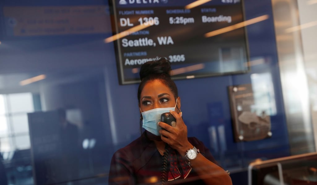 A Delta Air Lines gate agent makes an announcement for air travellers at JFK International Airport in New York on August 6. Airport personnel are legally liable to make sure each traveller meets the requirements of the jurisdictions they are heading to. Photo: Reuters