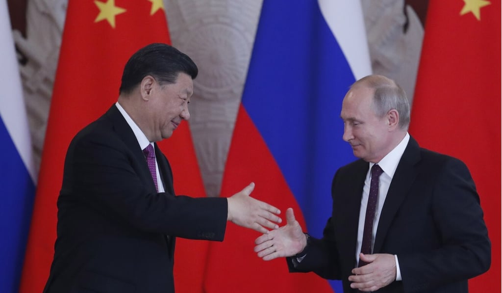 Chinese President Xi Jinping (left) and Russian President Vladimir Putin shake hands at the end of their joint news conference following their talks at the Kremlin in Moscow on June 5. Photo: EPA-EFE Chinese President Xi Jinping (left) and Russian President Vladimir Putin shake hands at the end of their joint news conference following their talks at the Kremlin in Moscow on June 5. Photo: EPA-EFE