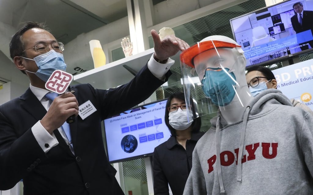 Professor Alexander Wai Ping-kong, vice-president of research development at Hong Kong Polytechnic University, explains the use of a mass-produced 3D protective face shield that is being worn by hospital workers during the Covid-19 outbreak. Photo: K.Y. Cheng