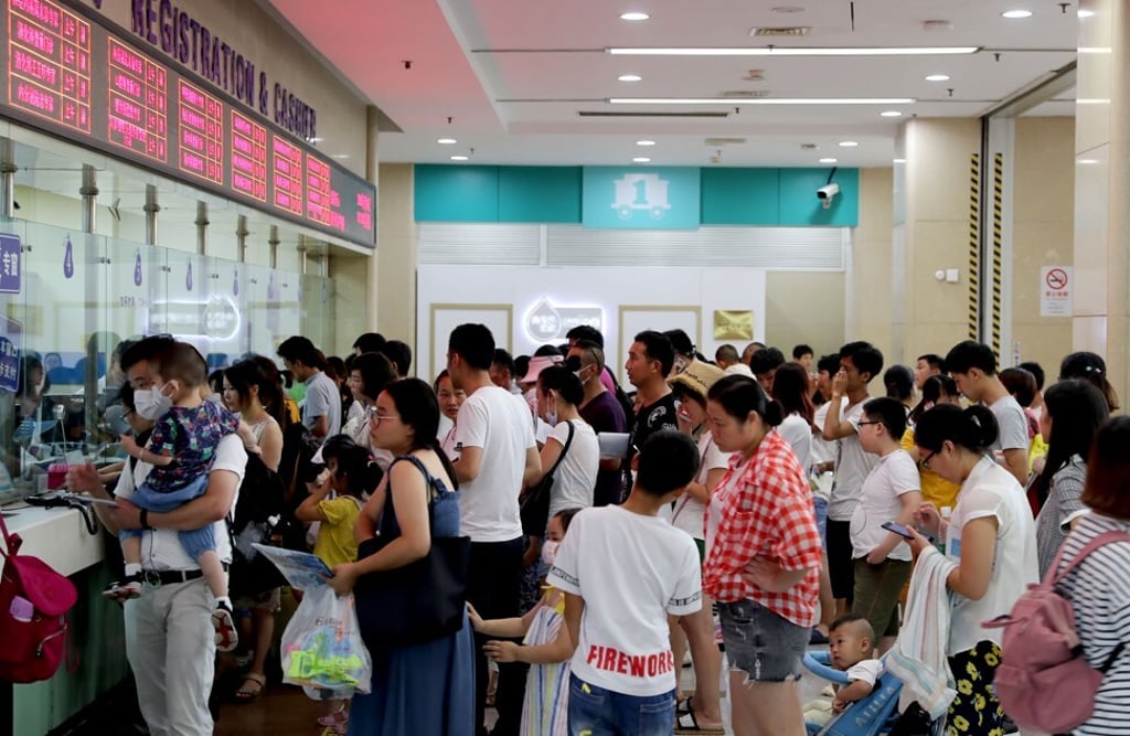 Parents queue to make appointments for their children to see doctors in Beijing – a process that often proves very difficult and time-consuming in mainland China. Photo: Xinhua Parents queue to make appointments for their children to see doctors in Beijing – a process that often proves very difficult and time-consuming in mainland China. Photo: Xinhua