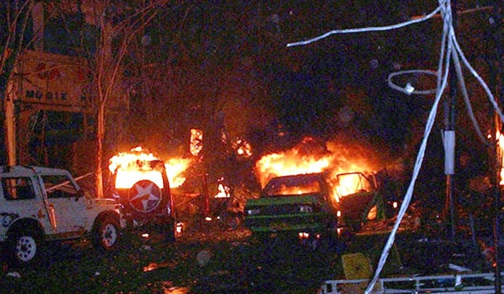 Buildings and cars burn in Kuta, Bali 13 October 2002, after a bomb exploded at a popular nightclub on the Indonesian resort island of Bali. Photo: AFP Buildings and cars burn in Kuta, Bali 13 October 2002, after a bomb exploded at a popular nightclub on the Indonesian resort island of Bali. Photo: AFP