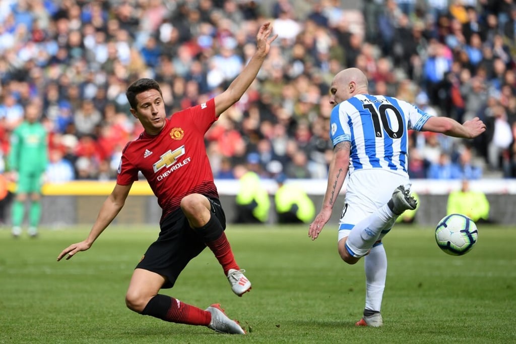 Mooy in action for Huddersfield Town against Manchester United in 2019. Photo: AFP