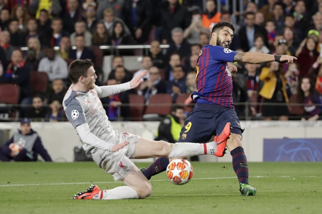 Liverpool's Andy Robertson and Barcelona's Luis Suarez in the Uefa Champions League. Suarez left Liverpool for Barcelona. Photo: AP