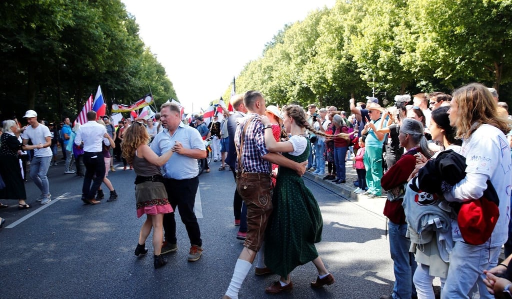 Demonstrators dance during a rally in Berlin. Photo: Reuters