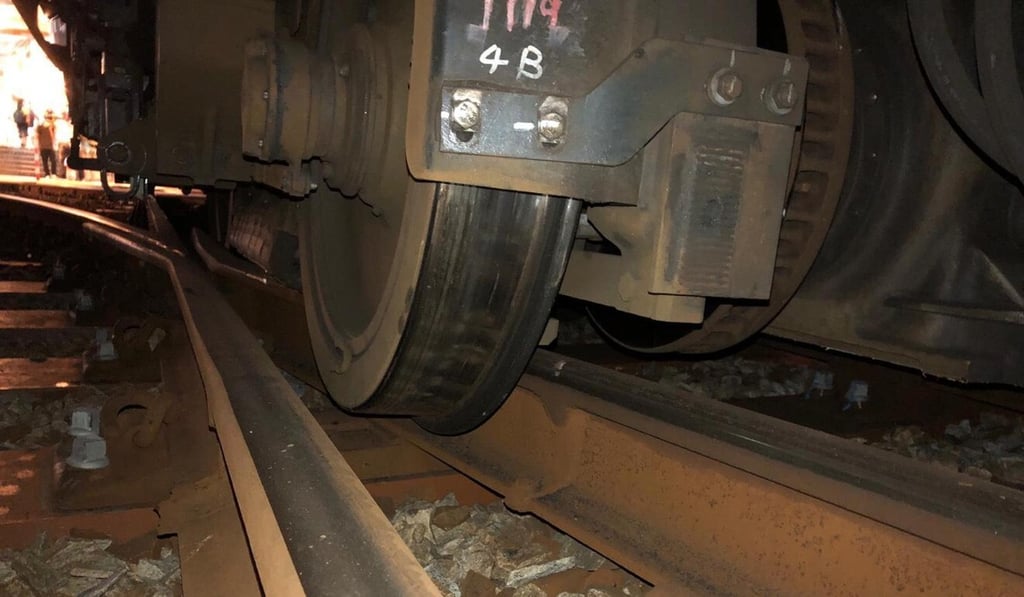 The wheels of an MTR light rail train that skipped the tracks as it entered the platform at the Siu Hong stop on Saturday night. Photo: Handout
