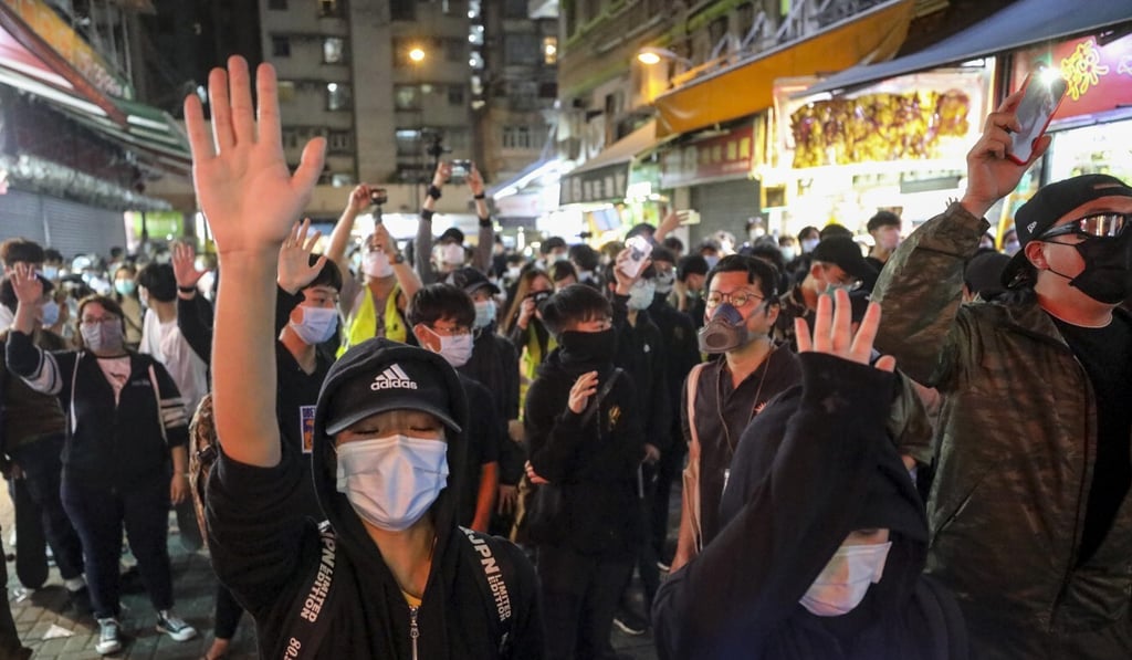 Protesters take part in a rally in Yuen Long marking the eight month anniversary of the attack. Photo: Dickson Lee Protesters take part in a rally in Yuen Long marking the eight month anniversary of the attack. Photo: Dickson Lee