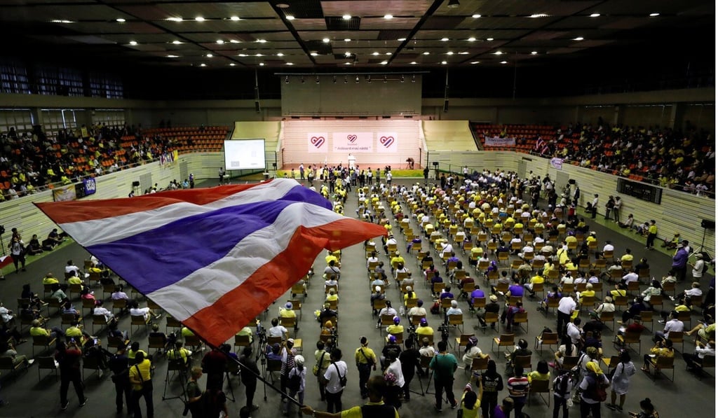 A person waves a Thai national flag as members of Thai group “Thai Pakdee” (Loyal Thai) attend a rally in support of the government and the monarchy. Photo: Reuters A person waves a Thai national flag as members of Thai group “Thai Pakdee” (Loyal Thai) attend a rally in support of the government and the monarchy. Photo: Reuters