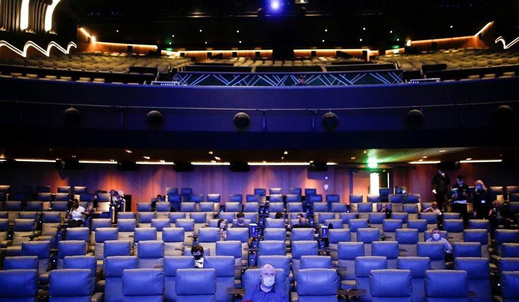 People take their seats inside the Odeon Luxe Leicester Square cinema, on the opening day of the film ‘Tenet’, in London. Photo: Reuters People take their seats inside the Odeon Luxe Leicester Square cinema, on the opening day of the film ‘Tenet’, in London. Photo: Reuters