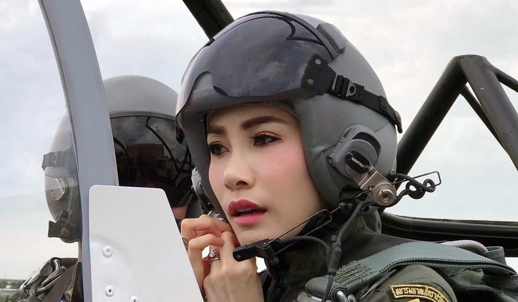 Sineenat Wongvajirapakdi adjusting her pilot’s helmet in a military aircraft during training. Photo: EPA Sineenat Wongvajirapakdi adjusting her pilot’s helmet in a military aircraft during training. Photo: EPA