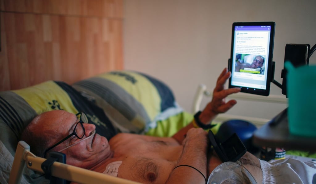 Cocq looks at a tablet PC from his medical bed. Photo: Reuters Cocq looks at a tablet PC from his medical bed. Photo: Reuters