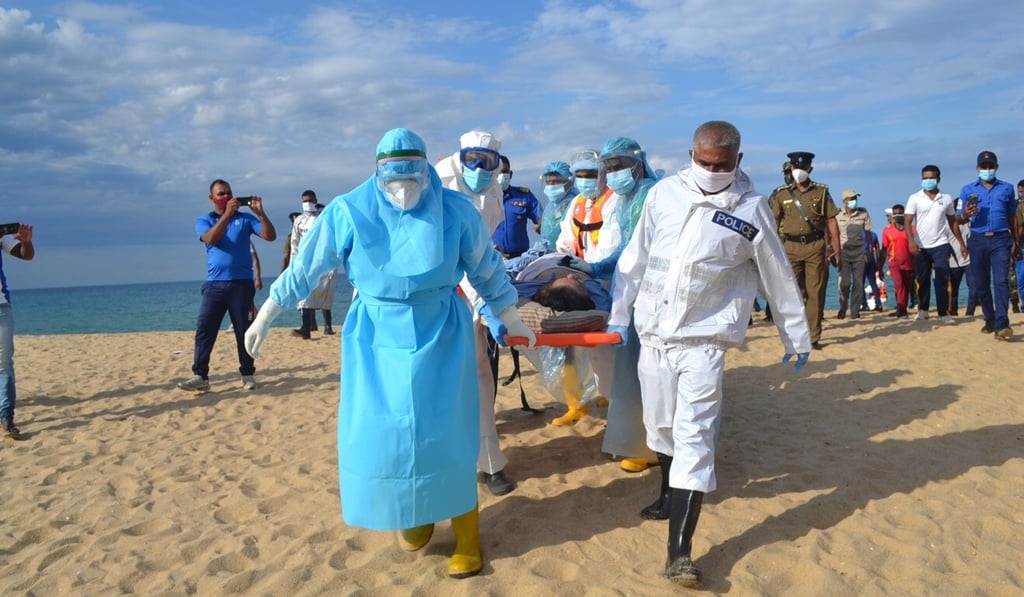 An injured crew member from the New Diamond is taken to an ambulance in Kalmunai, Sri Lanka on Thursday. Photo: Reuters