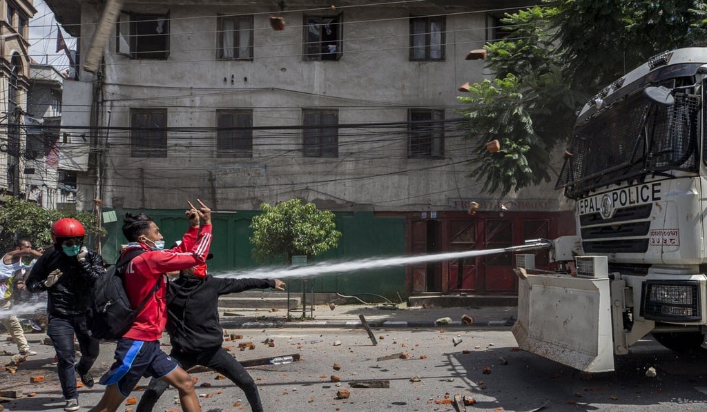Devotees and riot police clash in Lalitpur, Nepal. Photo: EPA
