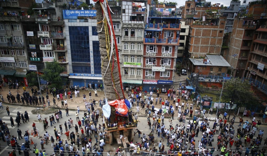 People pull the chariot of Deity Rato Machindranath in Lalitpur on Thursday. Photo: DPA