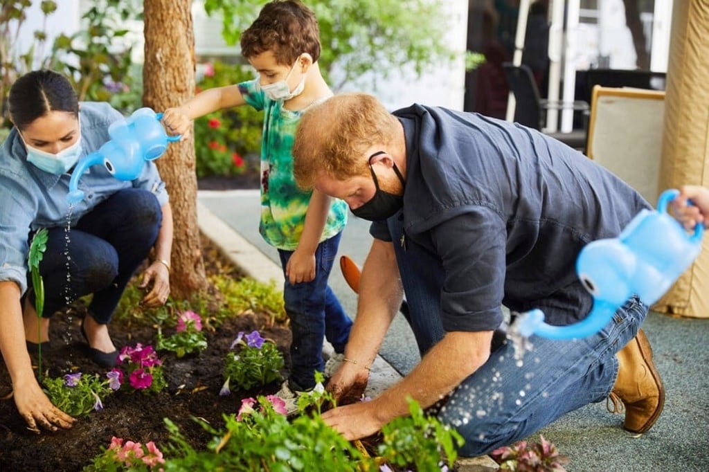 Prince Harry and Meghan Markle, the Duke and Duchess of Sussex, plant flowers during a visit to the Assistance League Los Angeles' Preschool Learning Center in August, 2020. Photo: Reuters Prince Harry and Meghan Markle, the Duke and Duchess of Sussex, plant flowers during a visit to the Assistance League Los Angeles' Preschool Learning Center in August, 2020. Photo: Reuters