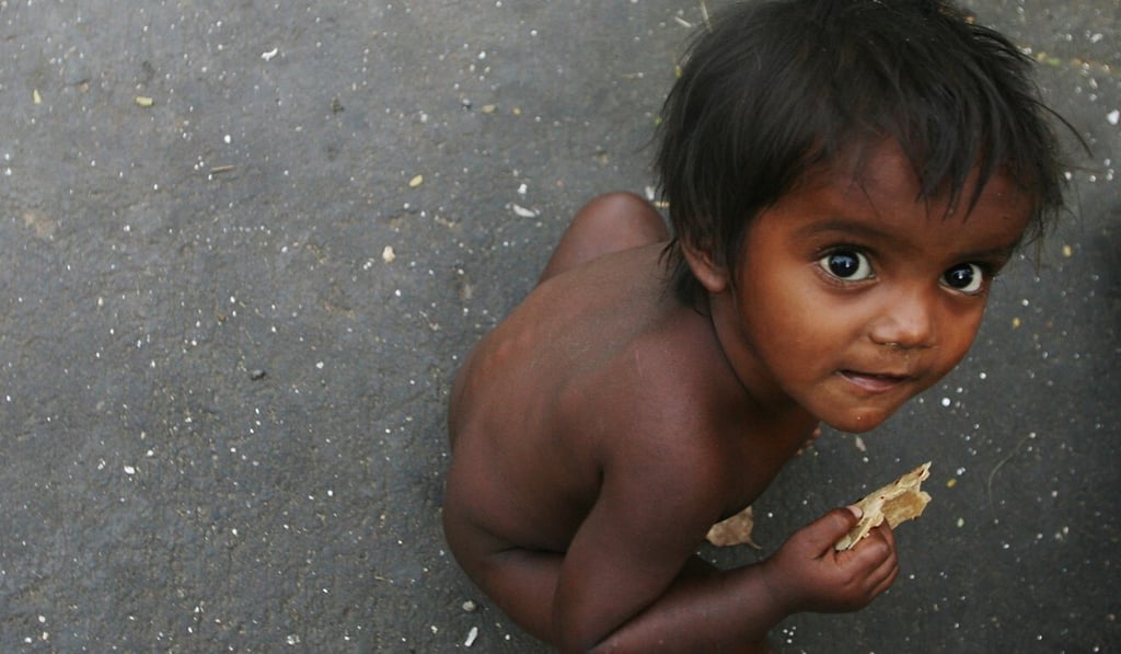 A boy eats roti at a slum in Mumbai. Tens of millions of Indian children suffer malnutrition. Photo: Reuters