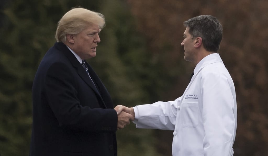 Trump shakes hands with Dr Ronny Jackson at the Walter Reed National Military Medical Centre in Bethesda, Maryland, in 2018. Photo: AFP