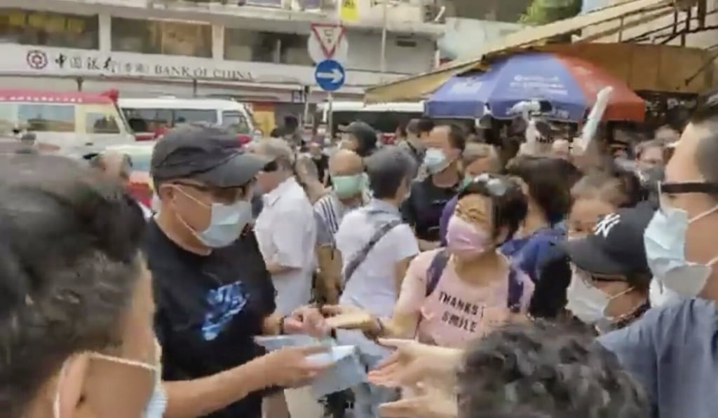 Activist Tam Tak-chi set up street booths across Hong Kong in June and August, where he gave out face masks and criticised the government. Photo: Facebook