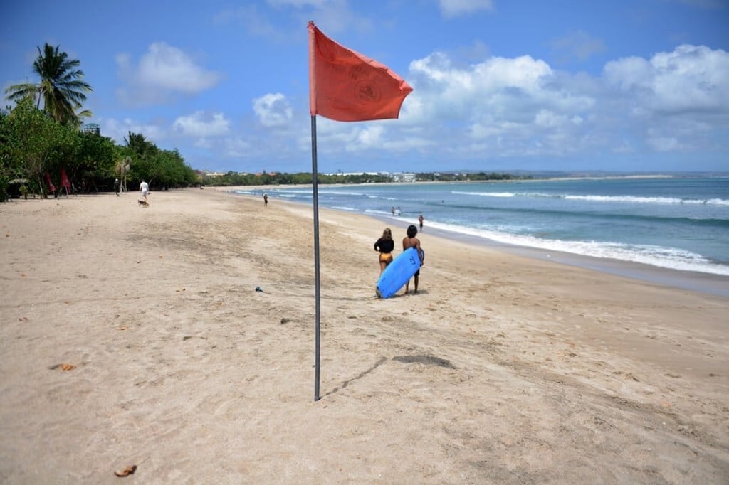 A quiet Kuta beach, in August. Photo: AFP A quiet Kuta beach, in August. Photo: AFP
