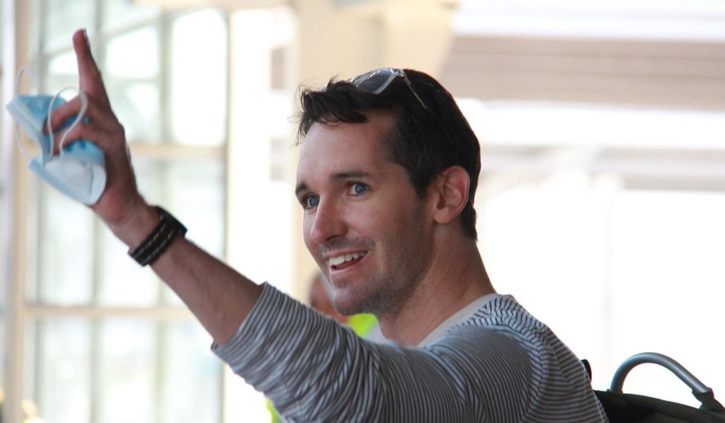 ABC journalist Bill Birtles waves as he arrives in Sydney on Tuesday. Photo: AFP ABC journalist Bill Birtles waves as he arrives in Sydney on Tuesday. Photo: AFP
