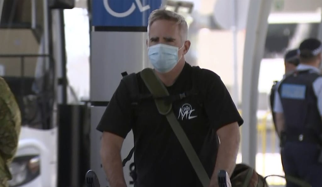 Australian journalist Michael Smith arrives at Sydney airport on Tuesday after leaving mainland China. Photo: AP Australian journalist Michael Smith arrives at Sydney airport on Tuesday after leaving mainland China. Photo: AP