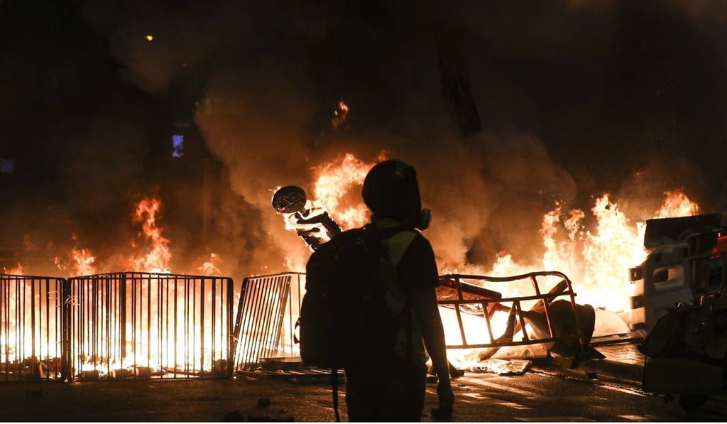 Protesters had set a roadblock in Wan Chai on fire on August 31 last year. Photo: Sam Tsang Protesters had set a roadblock in Wan Chai on fire on August 31 last year. Photo: Sam Tsang