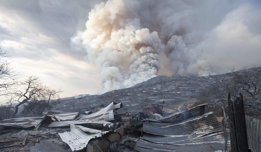 A burnt structure is seen on Saturday at a wildfire in Yucaipa, California, set off by a couple doing a gender reveal event for their child. Photo: AP