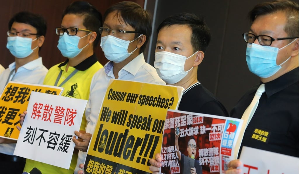 District councillor Roy Tam (third from left) and People Power lawmaker Raymond Chan (second from right) at the Legislative Council Complex in Tamar on Wednesday. Photo Dickson Lee District councillor Roy Tam (third from left) and People Power lawmaker Raymond Chan (second from right) at the Legislative Council Complex in Tamar on Wednesday. Photo Dickson Lee