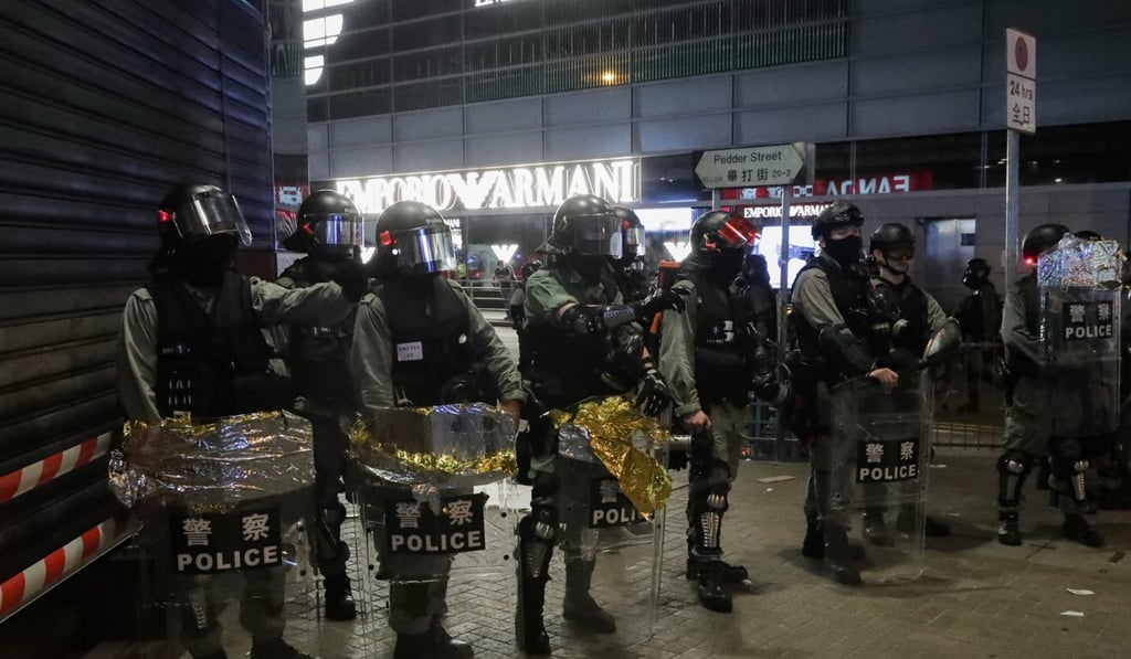 Police officers on Pedder Street in Central, near the scene of the incident involving the defendant, on November 2 last year. Photo: Edmond So Police officers on Pedder Street in Central, near the scene of the incident involving the defendant, on November 2 last year. Photo: Edmond So