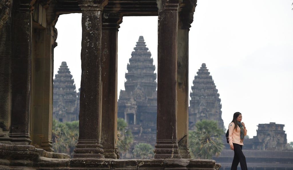 A guide walks at the Angkor Wat temple in Siem Reap province in March. Photo: AFP