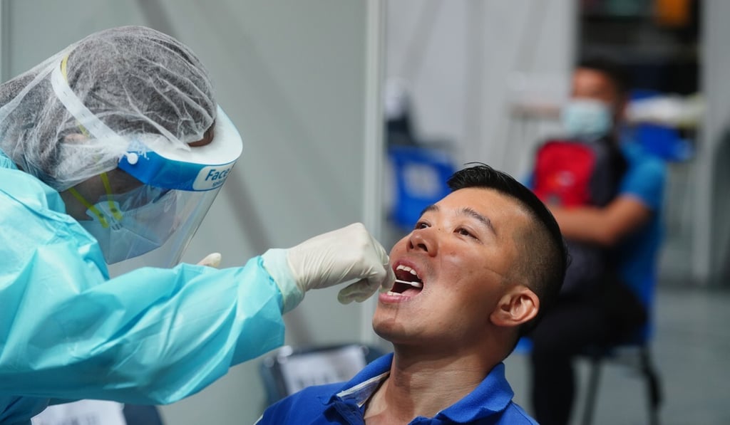 A Hong Kong resident takes part in the city’s mass Covid-19 testing programme in Wan Chai earlier this month. Photo: Sam Tsang