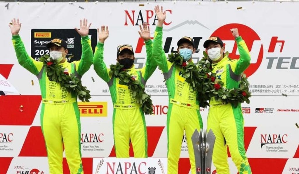 Hong Kong racing car driver Shaun Thong (second from right) celebrates with Japanese teammates after winning the Fuji 24-Hour Super Tec race in Fuji, Japan. Photo: Handout