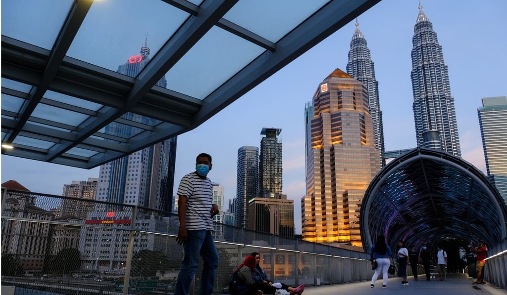 Pedestrians on the Saloma Link bridge in Kuala Lumpur, Malaysia. Photo: Bloomberg