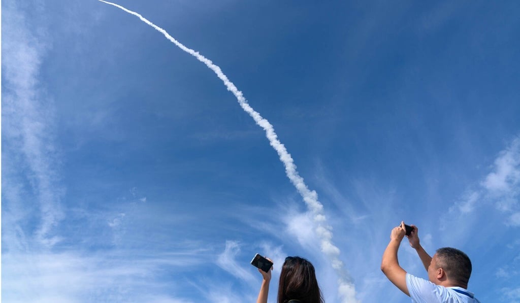 A Chinese rocket launched from a sea base carried nine satellites into space on Tuesday. Photo: Xinhua